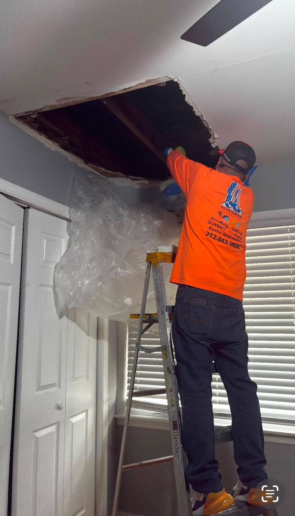Water-damaged ceiling mid-repair